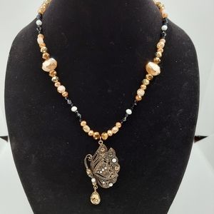 Glass beads and butterfly pendant